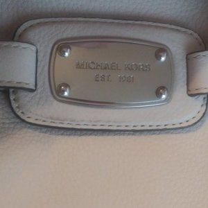 White Michael kors duffel bag.